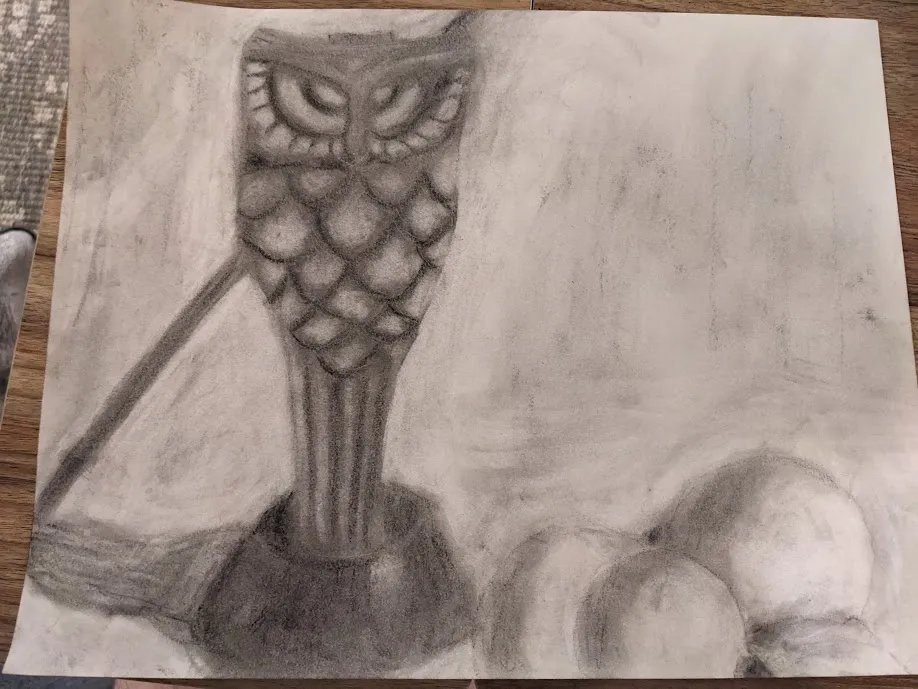Owl statue and fruit